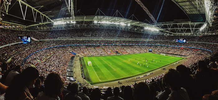 a large crowd attends a football match